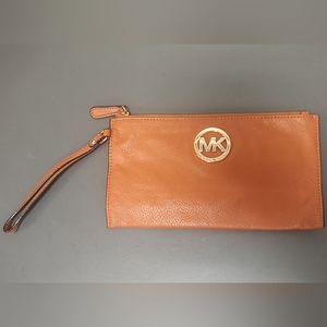 Michael Kors orange clutch wristlet with Gold MK Logo